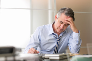 50080510 - frustrated stressed business man in an office